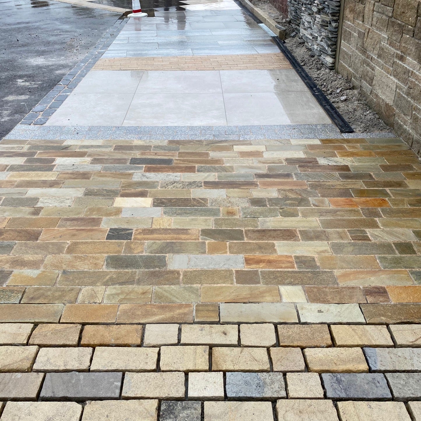 McMonagle Stone display area featuring Donegal Quartzite Paving Setts in Random Length x 100mm.