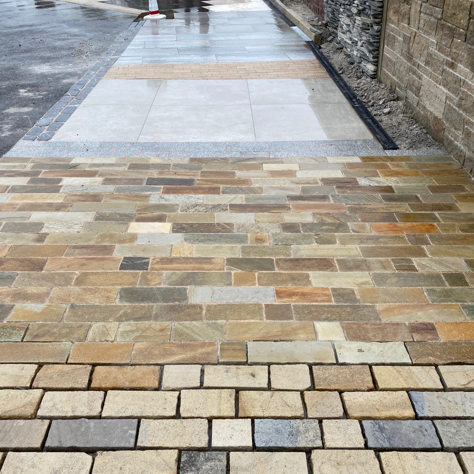 McMonagle Stone display area featuring Donegal Quartzite Paving Setts in Random Length x 100mm.