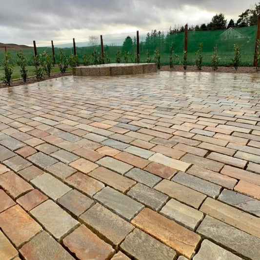 Patio area paved with Donegal Quartzite Paving Setts in Random Length x 100mm. Grout has not yet been installed. 