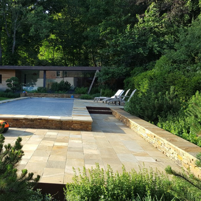 Contemporary Swimming pool and patio finished in Donegal Quartzite Sawn Paving. 