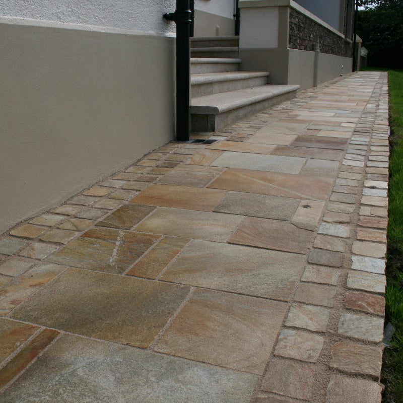 Pathway finished in Donegal Quartzite Sawn Paving and Cobbles in 100x100mm size.