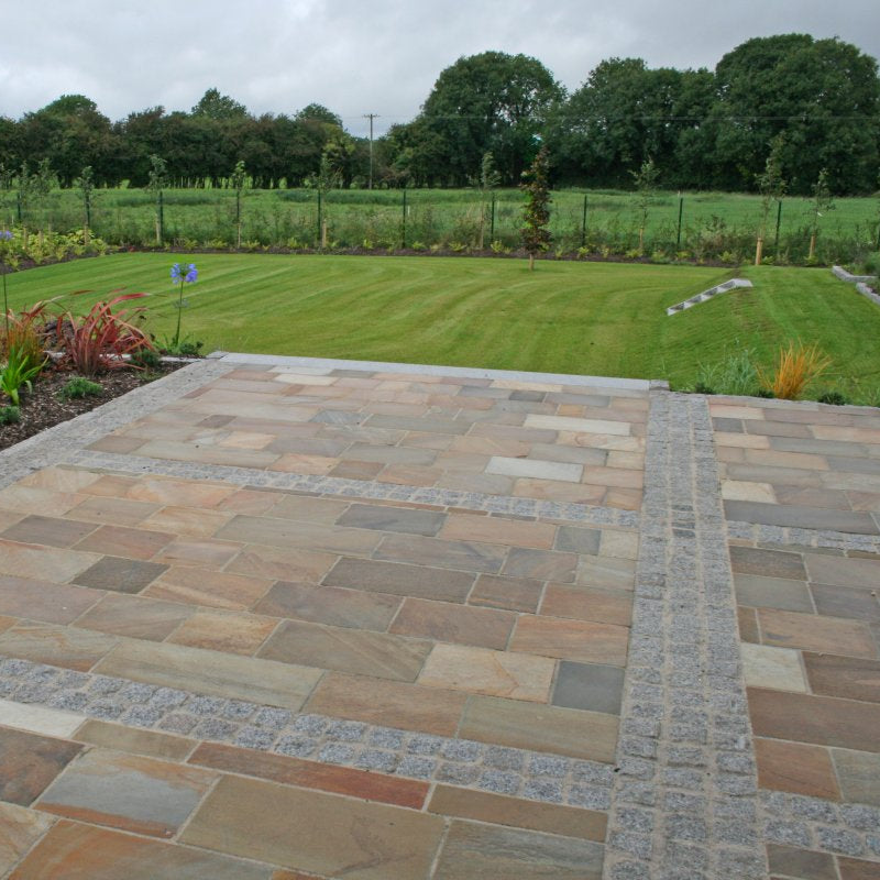 Large patio area and well maintained garden. Paving is Donegal Quartzite Sawn Paving and Silver Granite Cobbles in 100x100mm size. 
