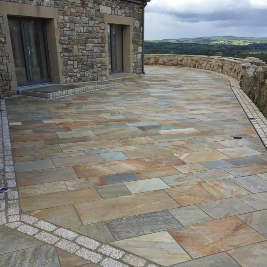 Large patio area finished in Donegal Quartzite Sawn Paving and Gold Granite Cobbles in 200 x 100mm 
