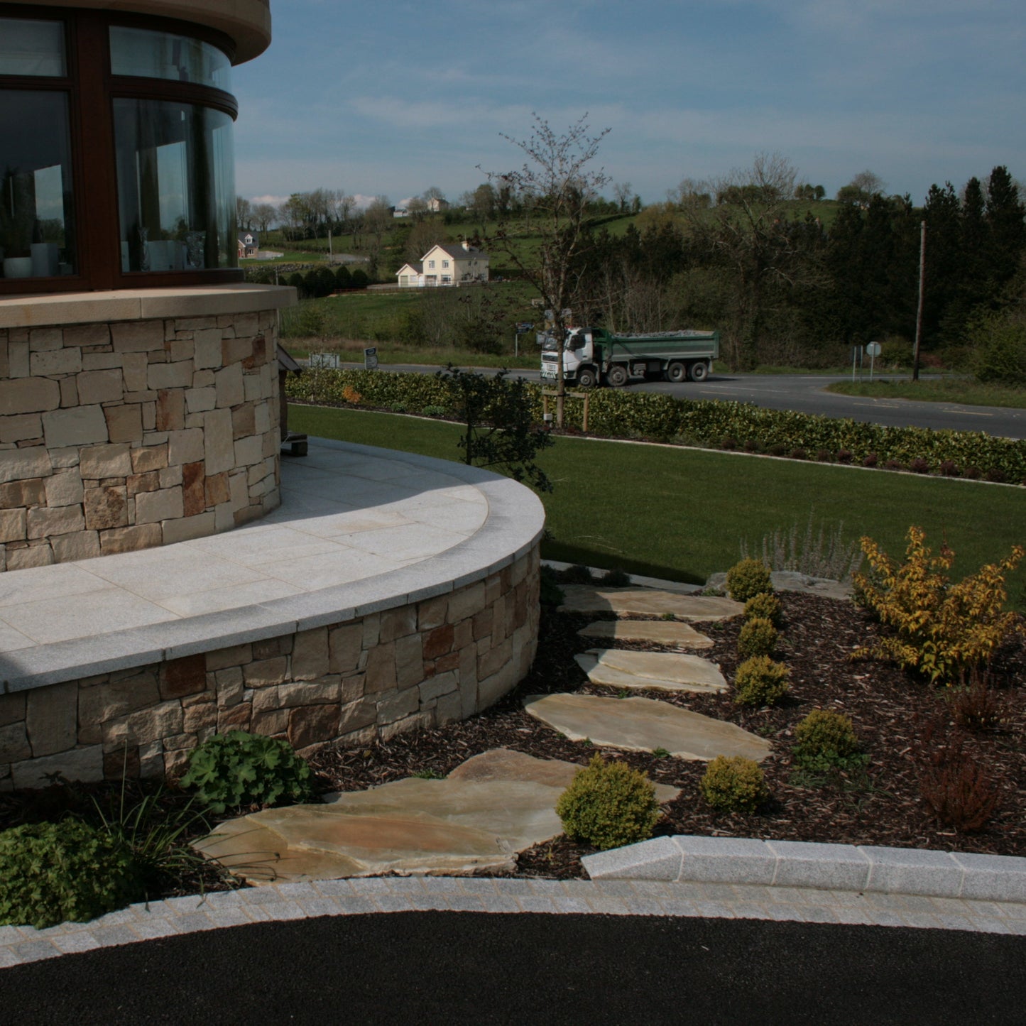 Modern Stone house with Donegal Quartzite Stepping Stones leading down to the garden.