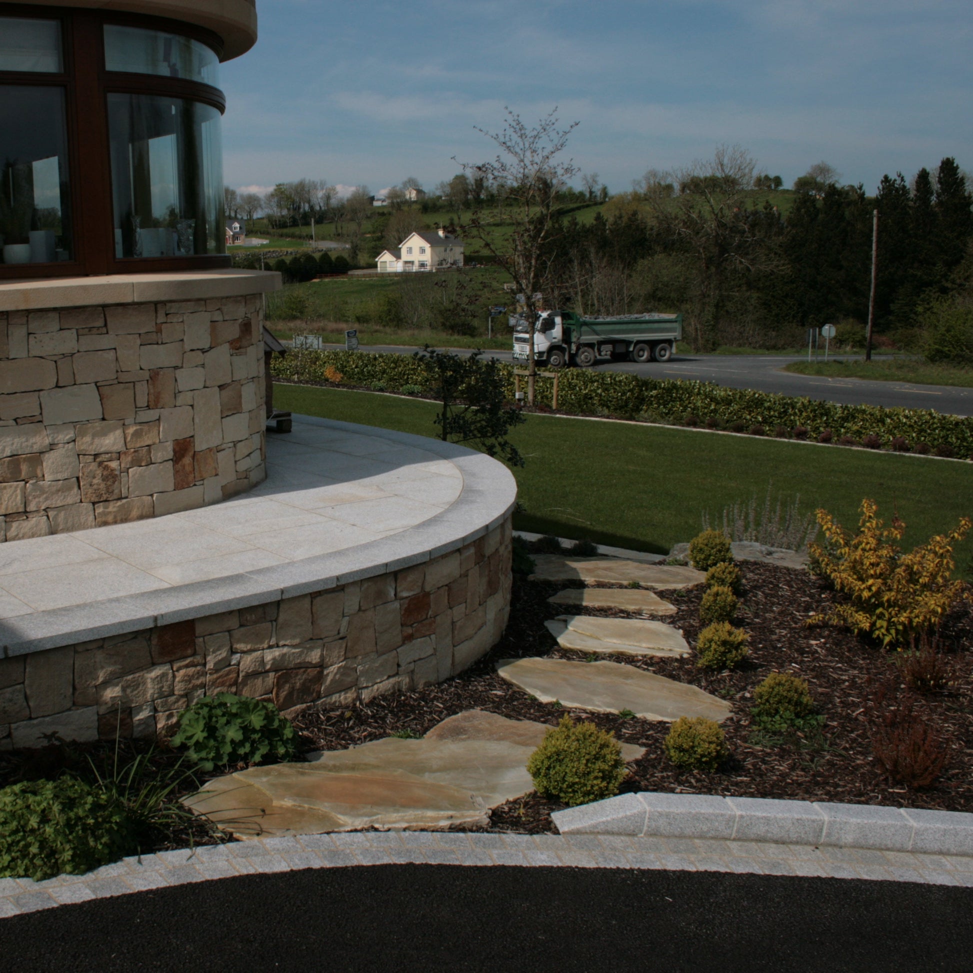 Modern Stone house with Donegal Quartzite Stepping Stones leading down to the garden.
