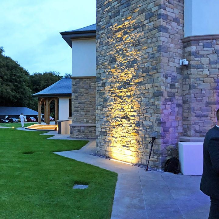 Luxury home with beautiful stonework completed in Dunhill Blend  Sandstone Machined. 