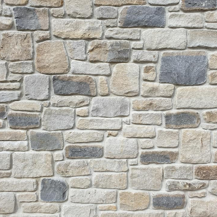 Close up of building stone stonework in Dunhill Blend Sandstone Tumbled. 