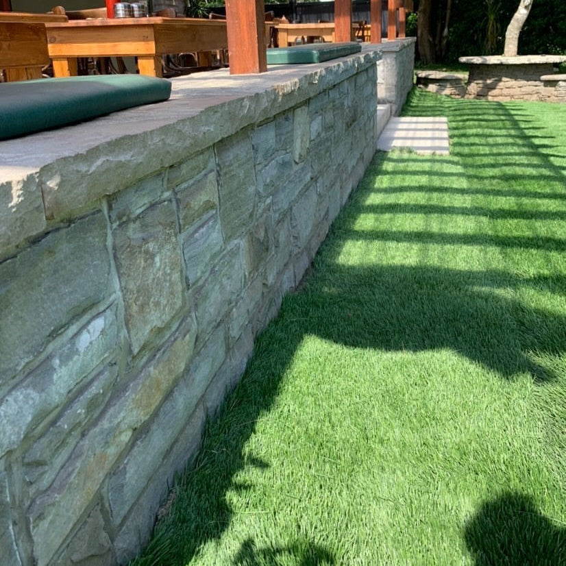 Garden wall completed in Dust Grey Sandstone Stoneer Cladding.