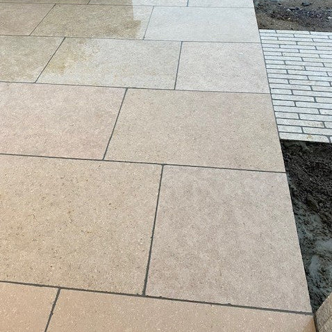 Close up of Egyptian Limestone paving and cobble pathway. 