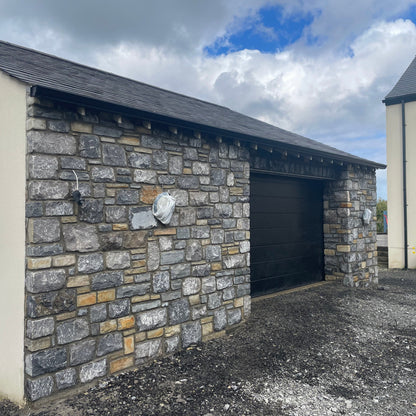New build garage with stone façade in Fieldstone Blend. 