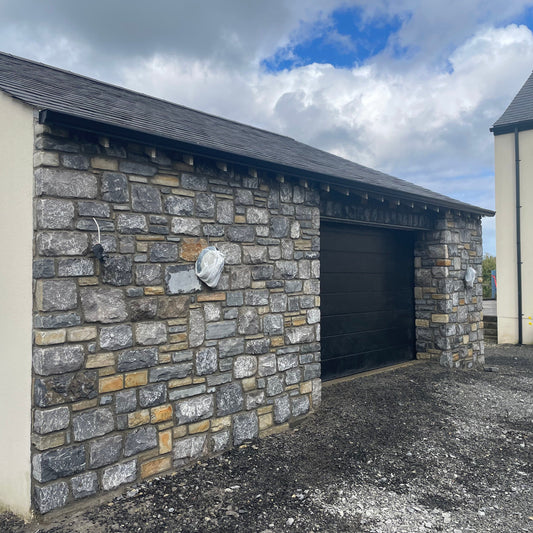 New build garage with stone façade in Fieldstone Blend. 