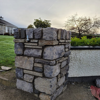 Stone pillar in Fieldstone Blend Tumbled stone walling.