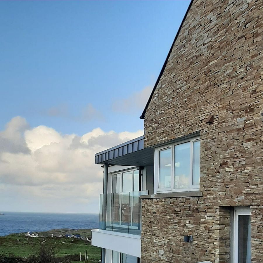 A close up of stonework completed using Gold Donegal Quartzite Garden Walling. 