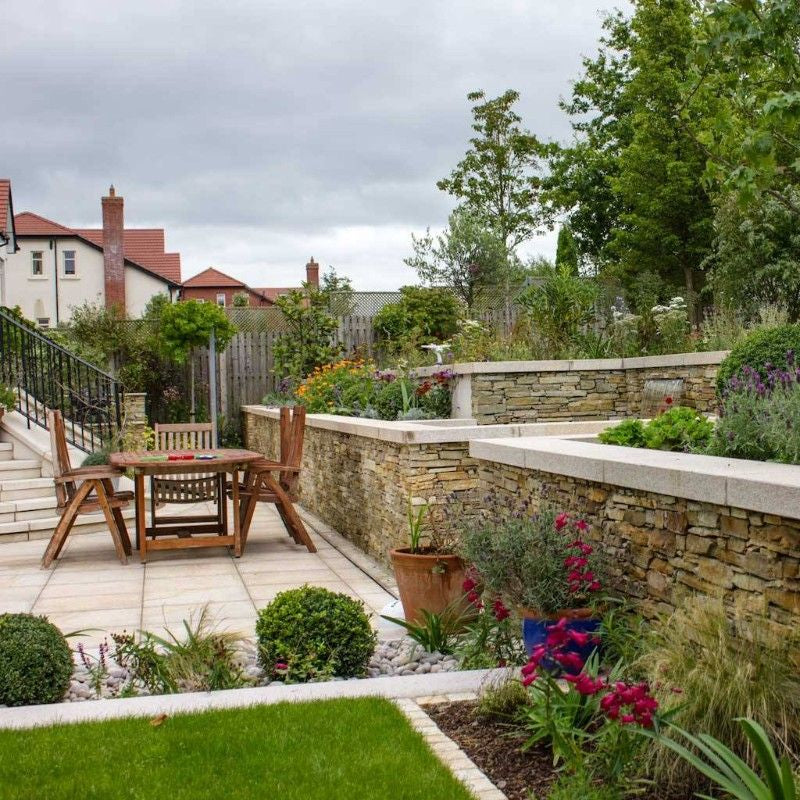 Patio area with beautiful garden walls completed using our Gold Donegal Quartzite Garden Walling in rugged form. 