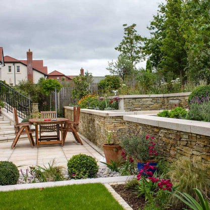 Patio area with beautiful garden walls completed using our Gold Donegal Quartzite Garden Walling in rugged form. 