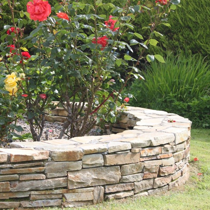 Garden feature wall completed using our Gold Donegal Quartzite Garden Walling in rugged form. 