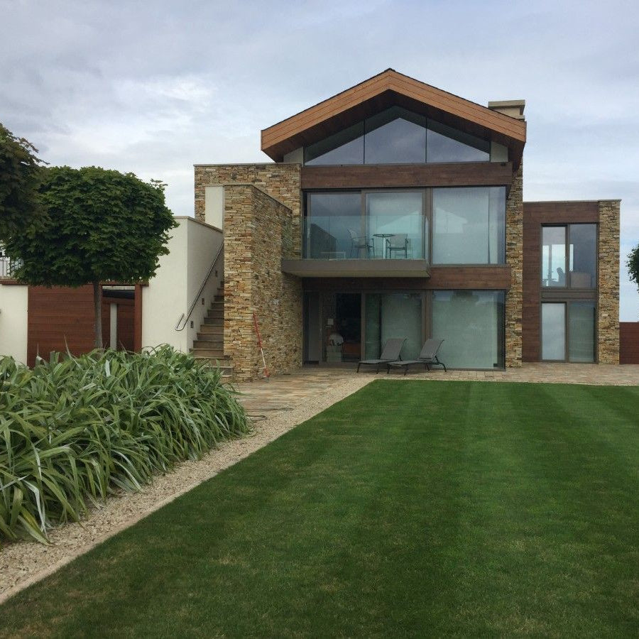 Modern house completed using Gold Donegal Quartzite Garden Walling. 