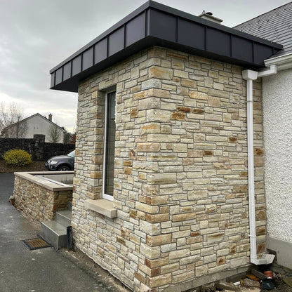 Porch extension and boundary wall completed using Gold Donegal Quartzite Machined walling stone. 
