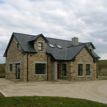 House completed using Gold Donegal Quartzite Random Rubble walling stone and Silver Granite Lintels and Sills. 