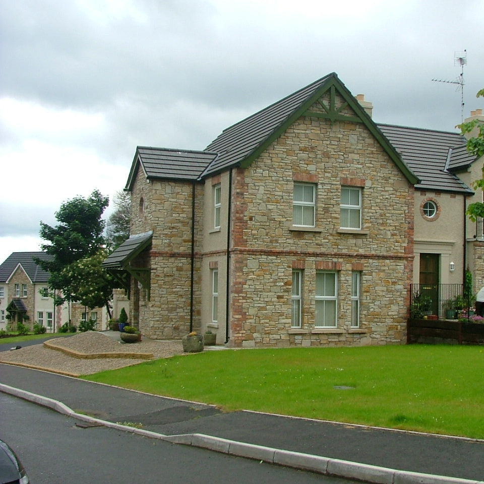 Housing estate with natural stone facades completed using our Gold Donegal Quartzite Random Rubble. 
