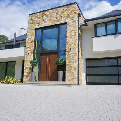 Modern new build with a natural stone façade completed using 30mm Gold Donegal Quartzite Stoneer Cladding. 