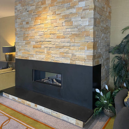 Internal stone fireplace in Gold Donegal Quartzite Stoneer Cladding.