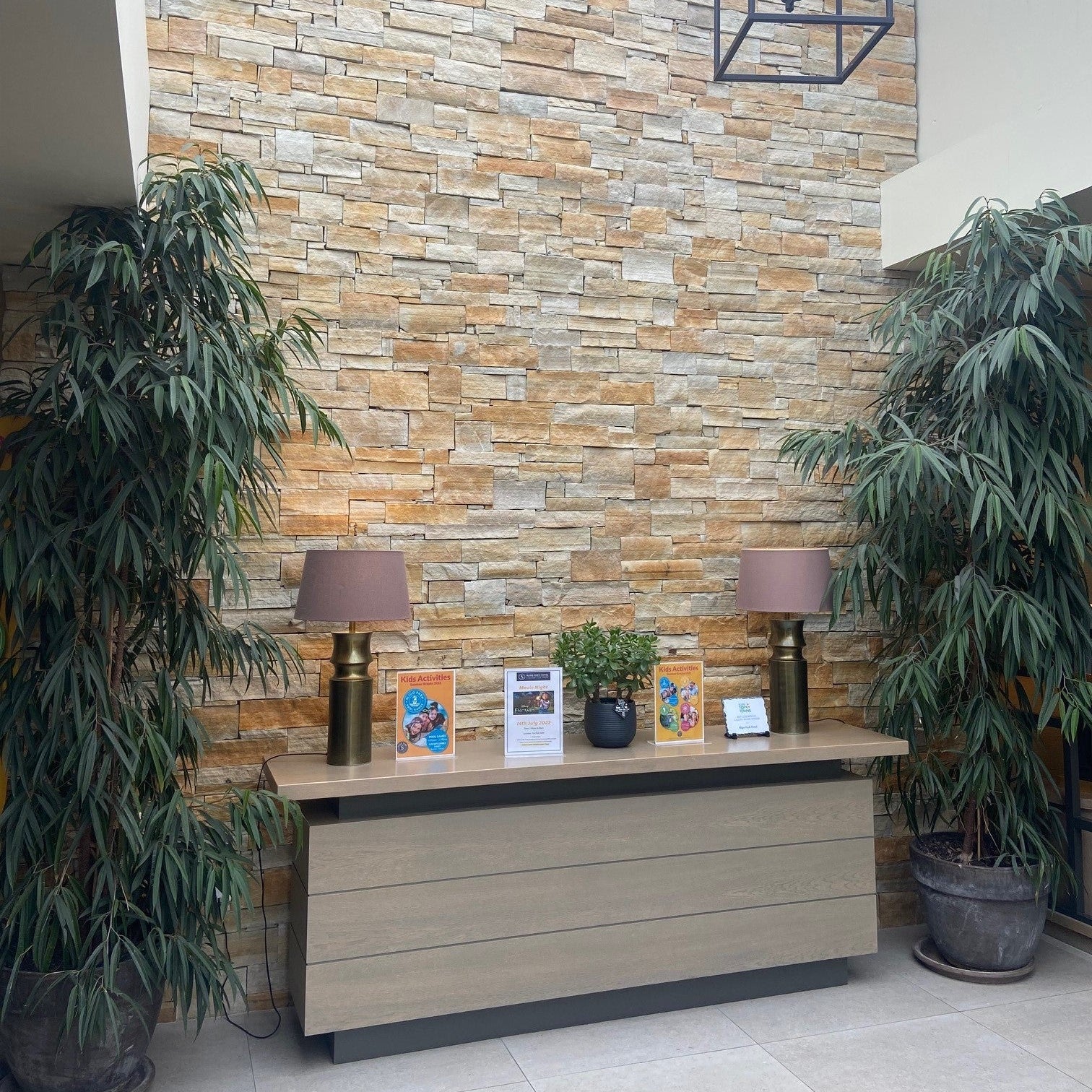 Hotel lobby feature wall completed using Gold Donegal Quartzite Stoneer Cladding. 