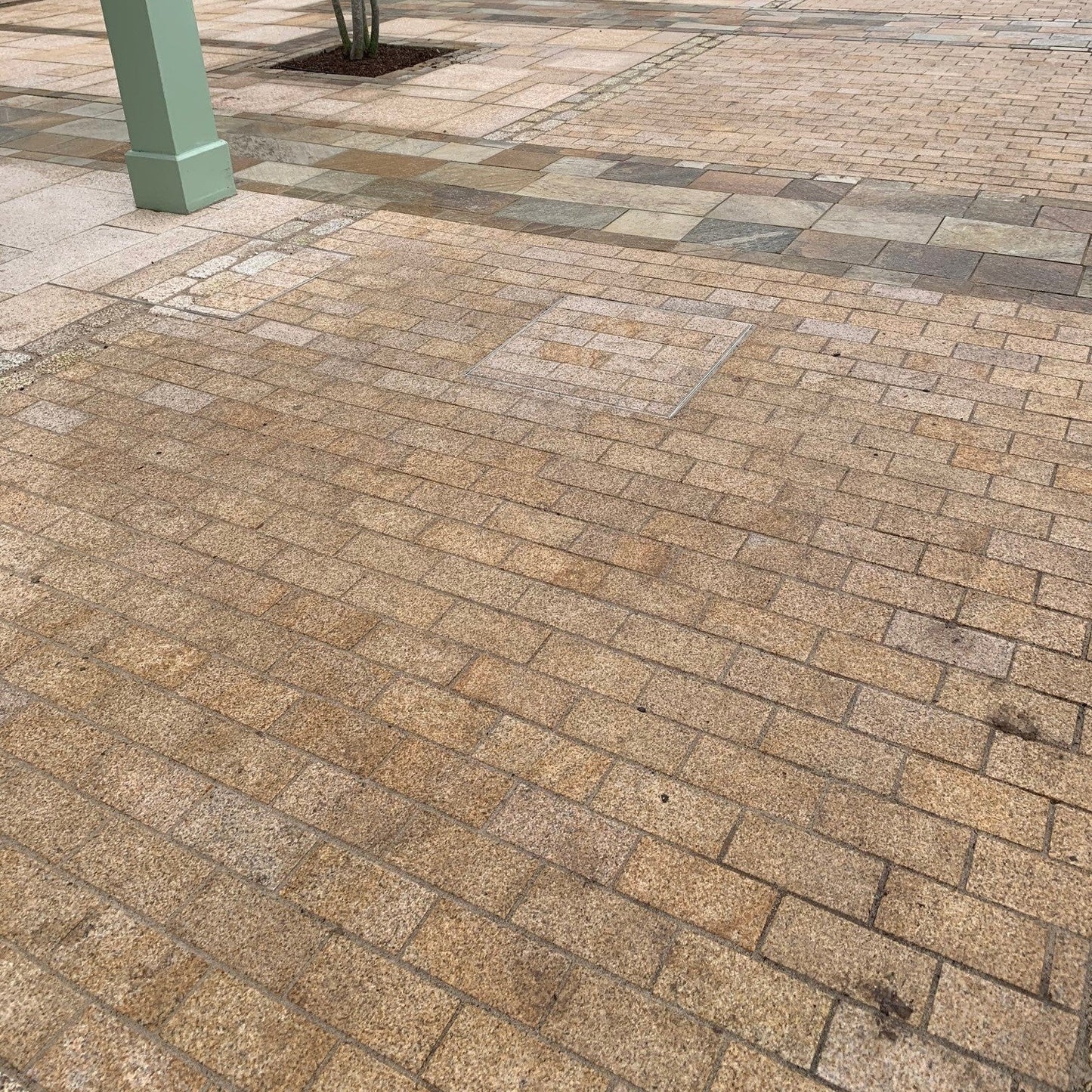 Patio area featuring Sawn Gold Granite Paving Cobbles. 