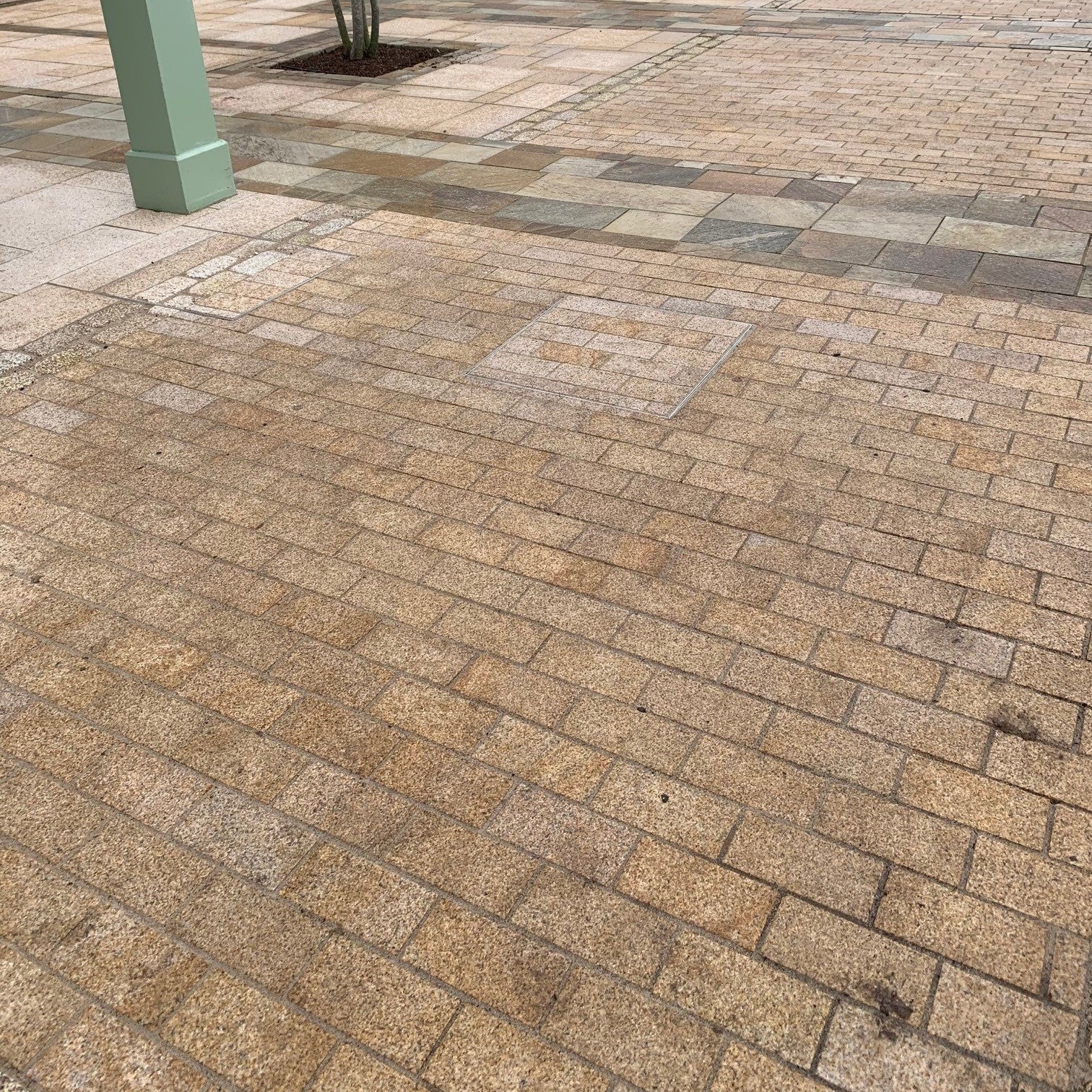 Patio area featuring Sawn Gold Granite Paving Cobbles. 