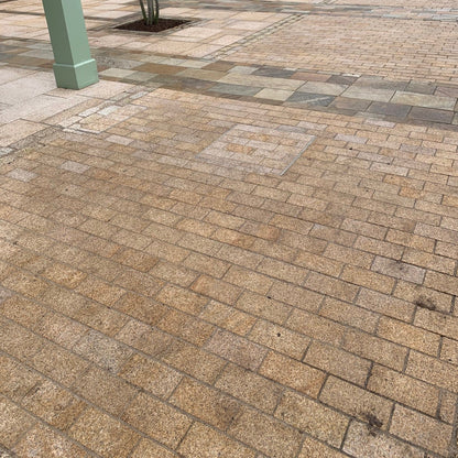 Patio area featuring Sawn Gold Granite Paving Cobbles. 