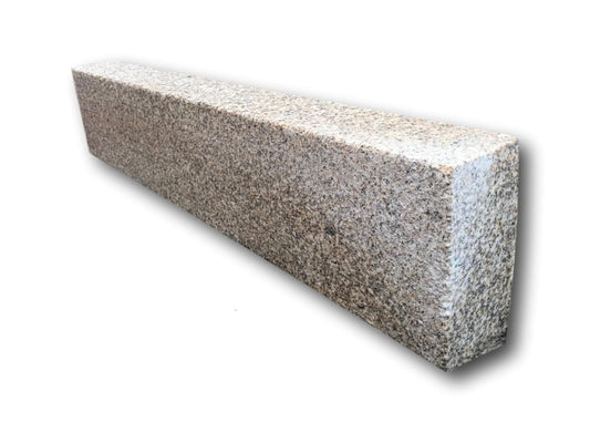 A single Gold Granite Kerb with a bush hammered finish. 