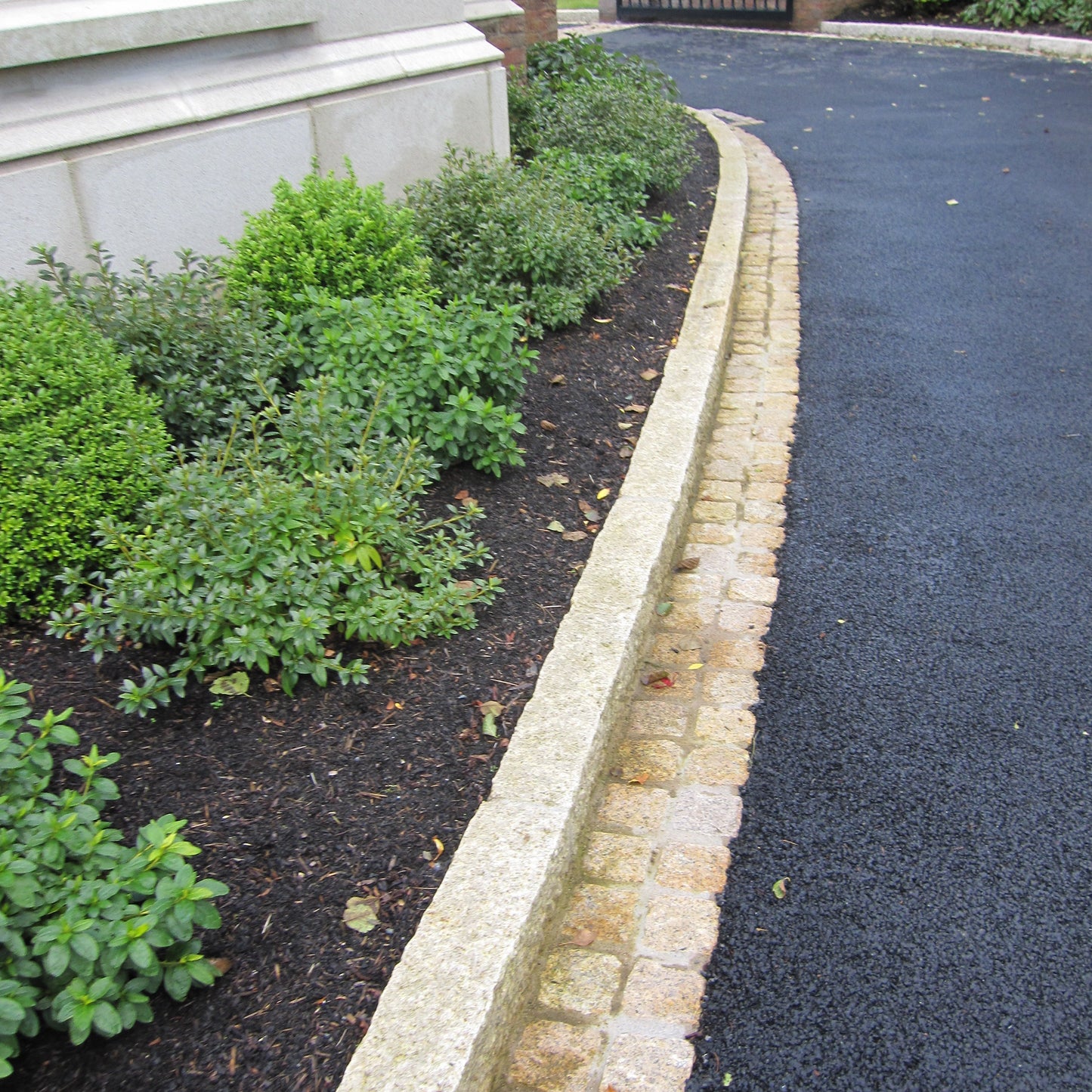 Driveway border completed using Gold Granite Kerbs and cobbles. 