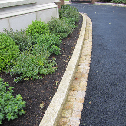 Driveway border completed using Gold Granite Kerbs and cobbles. 