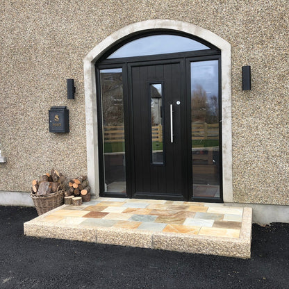 Front door step completed using quartzite paving and gold granite kerbs with a pineapple finish. 