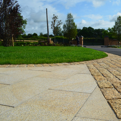 Close up of garden pathway leading to tarmac driveway. Paving chosen was Gold Granite in 600 x 300mm size. 