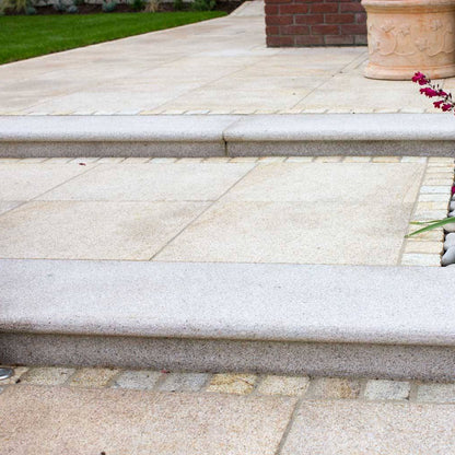 Patio and steps featuring Gold Granite Paving slabs in 600 x 600mm size. 