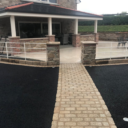 Tarmac driveway with natural stone pathway completed using Gold Granite Cobbles in 200 x 100mm size. 