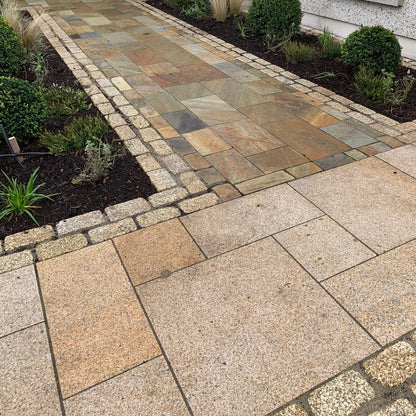 Pathway border completed using lightly tumbled Gold Granite Paving Cobbles in 200 x 100mm size. 