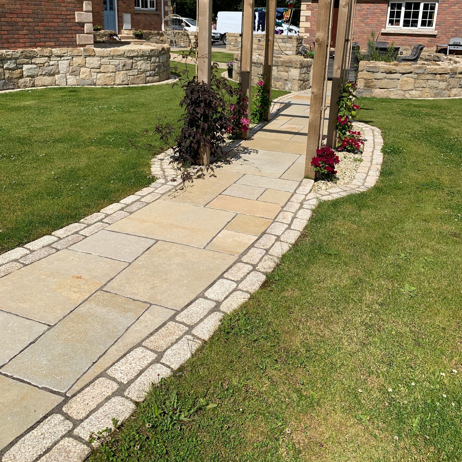 Garden pathway with double row of Gold Granite Paving Cobbles with a lightly tumbled finish. 
