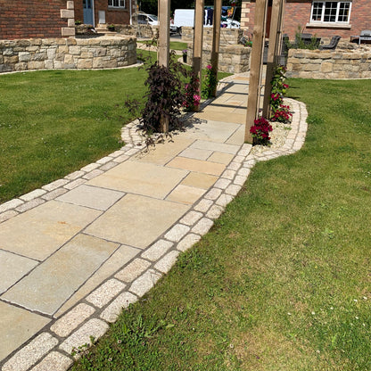 Garden pathway with double row of Gold Granite Paving Cobbles with a lightly tumbled finish. 
