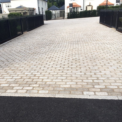 Residential area paving completed using Gold Granite Cobbles with a lightly tumbled finish. 