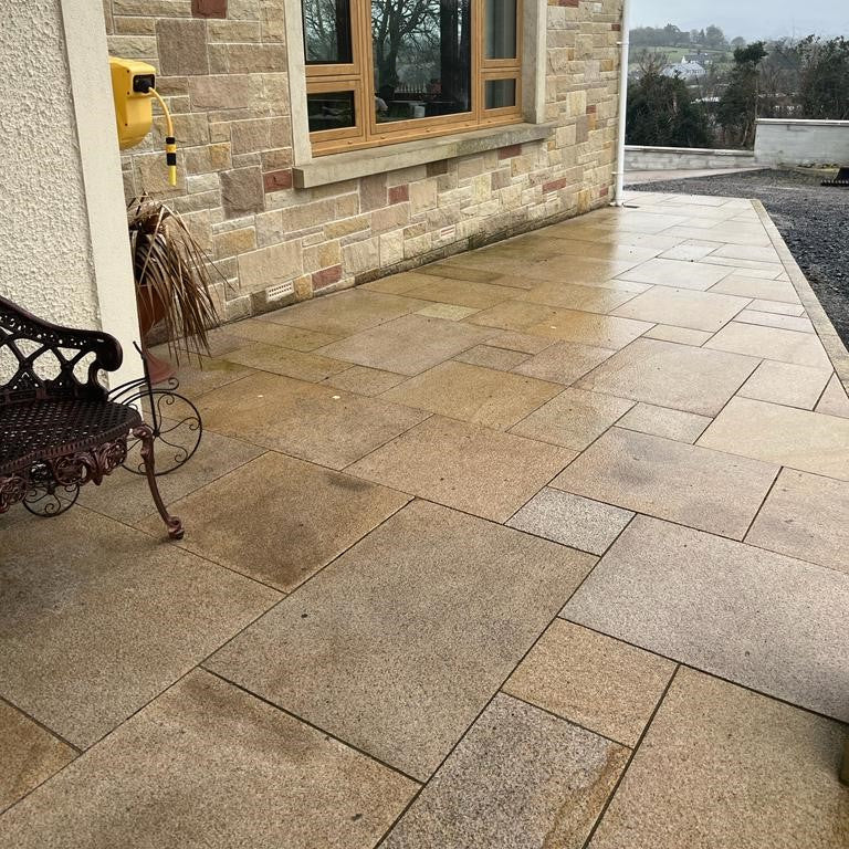 Gold Granite Patio Paving laid in mixed size laying pattern. 