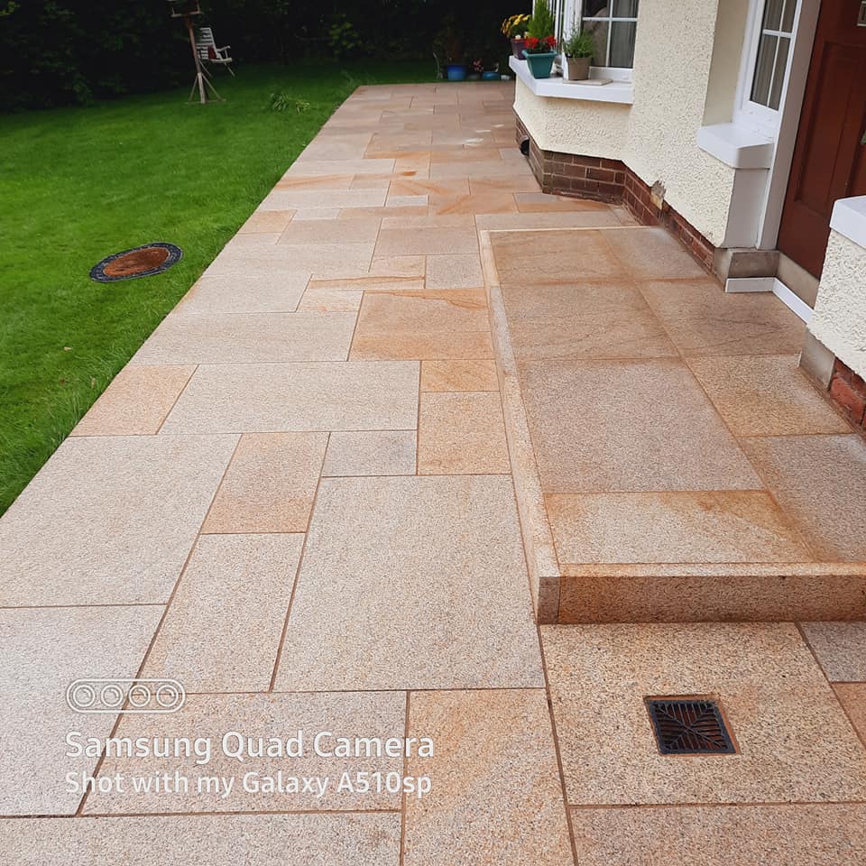 Pathway and step featuring Gold Granite Paving and Gold Granite Pin Kerbs around step. 