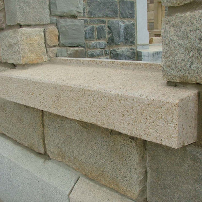Bespoke Gold Granite Sill with a textured finish. 
