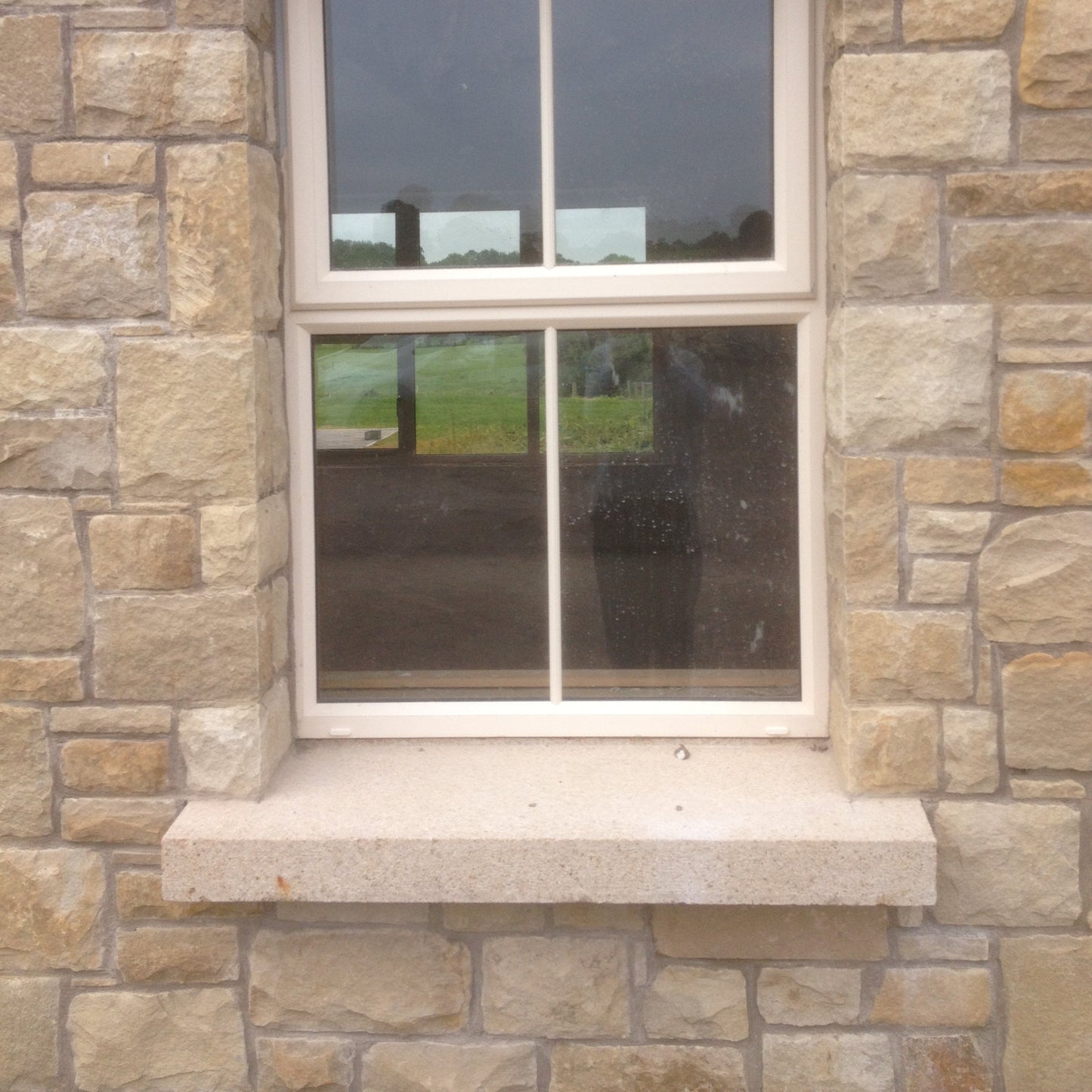 Window with bespoke Gold Granite Sill. 