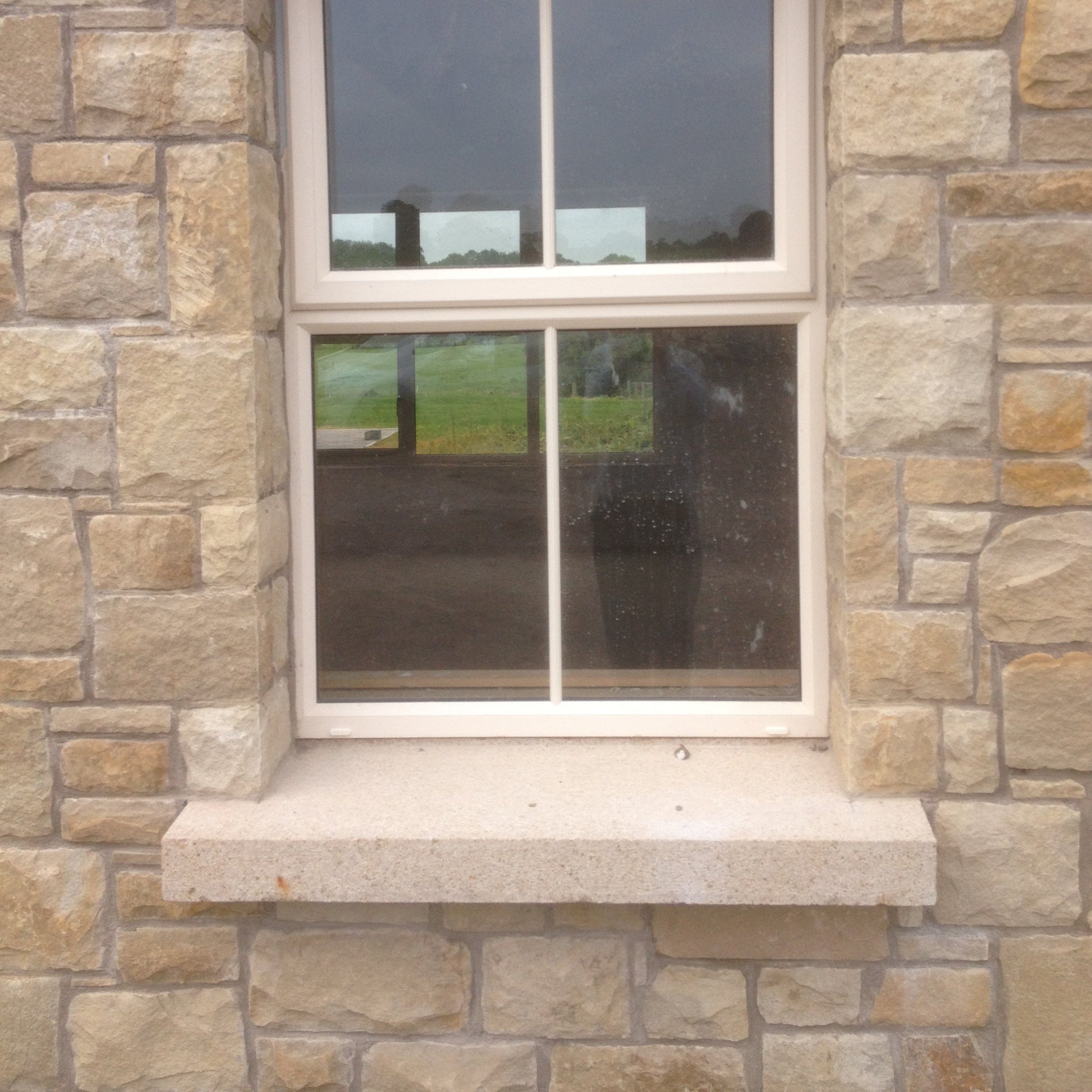 Window with bespoke Gold Granite Sill. 