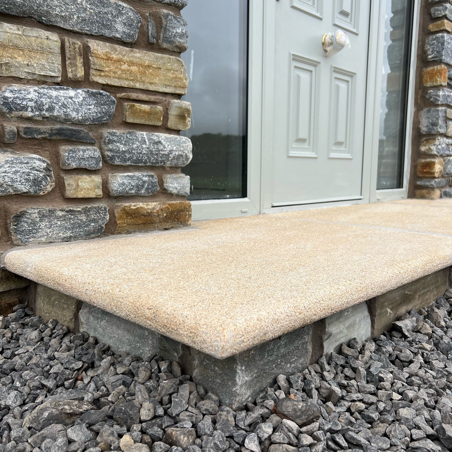 Close up of front door step in Gold Granite. 