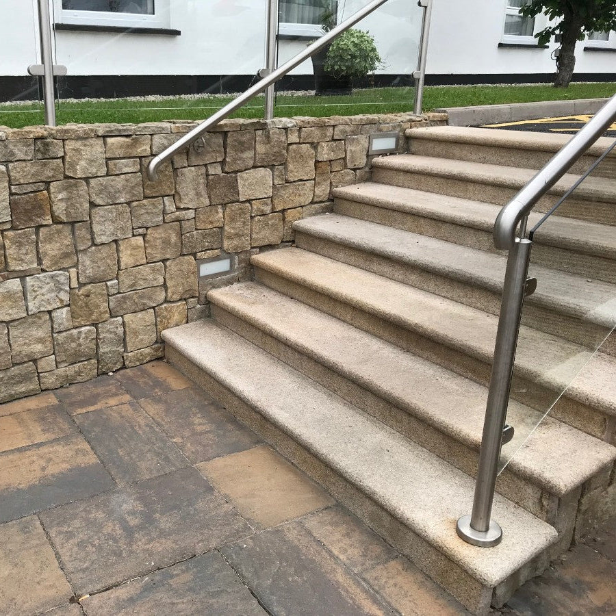 Gold Granite Steps leading up to hotel car pack. 