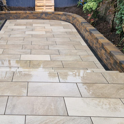 Newly laid patio featuring Gold Quartz Diva Range Porcelain Paving in a garden setting.