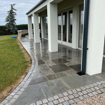 Modern pathway completed in Grey Sandstone Paving. 